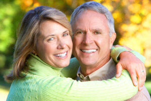 Dental Implants vs Bridges and Dentures Guide